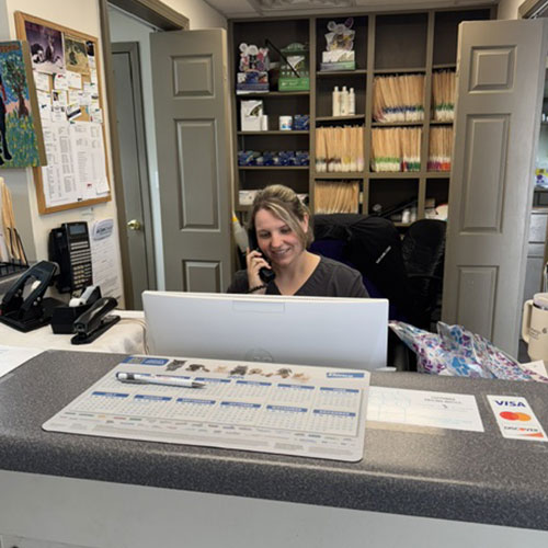 Receptionist answering the telephone Receptionist answering the telephone